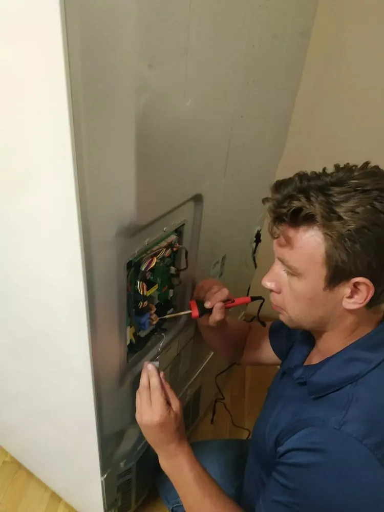 Slide of Appliance Repair Team