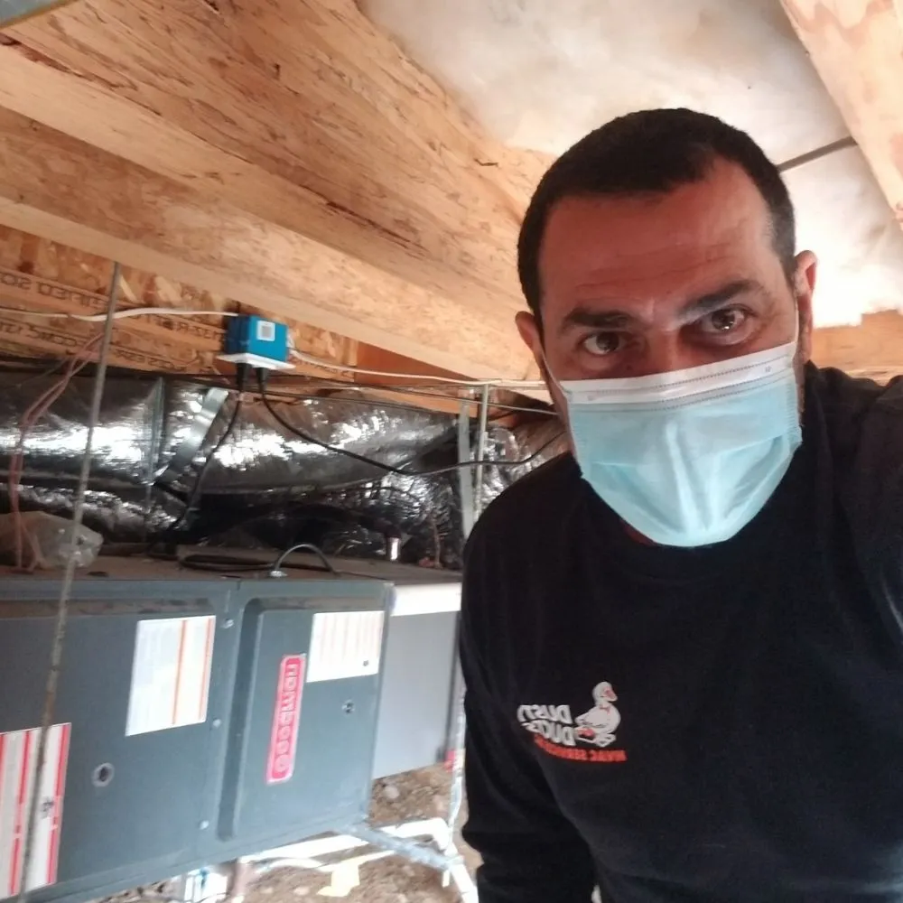 Slide of Dusty Ducts HVAC Services