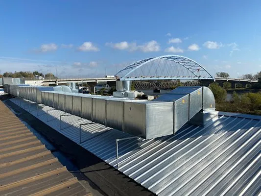 Hausman Metal Works & Roofing Logo