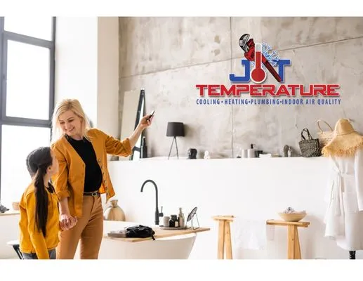 J T TEMPERATURE Logo