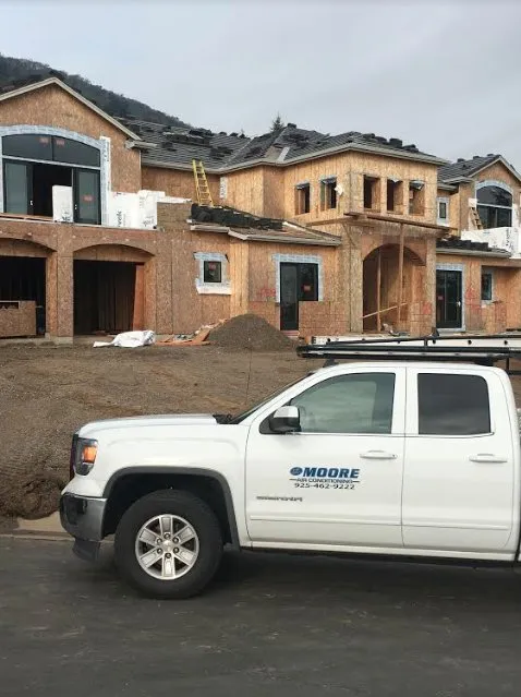 Slide of JE Moore Air Conditioning