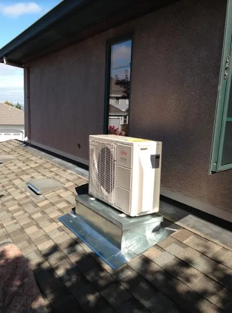 Slide of JE Moore Air Conditioning