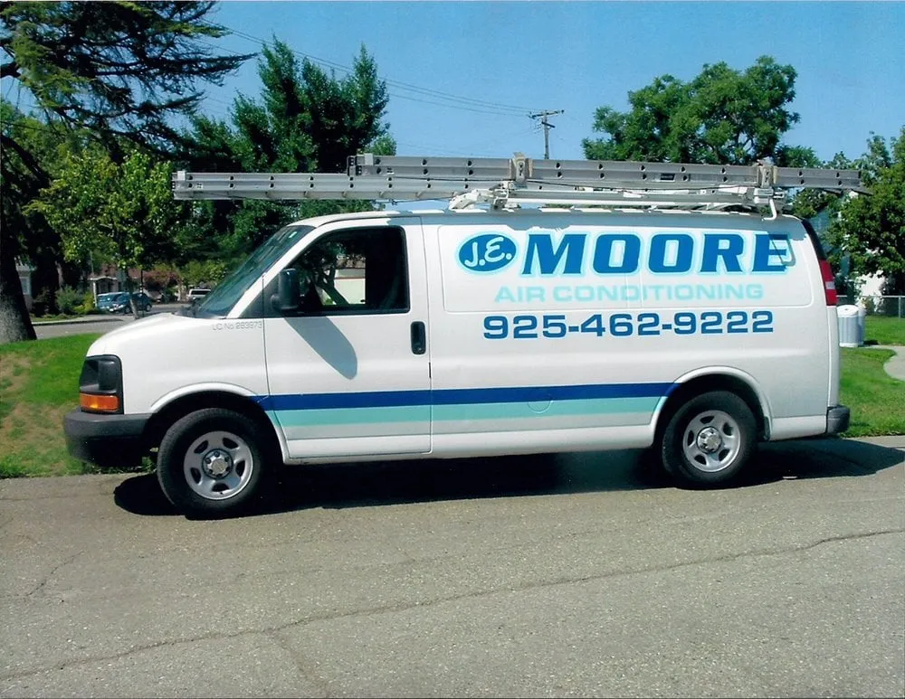 Slide of JE Moore Air Conditioning