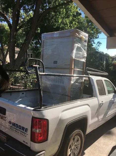 Slide of JE Moore Air Conditioning