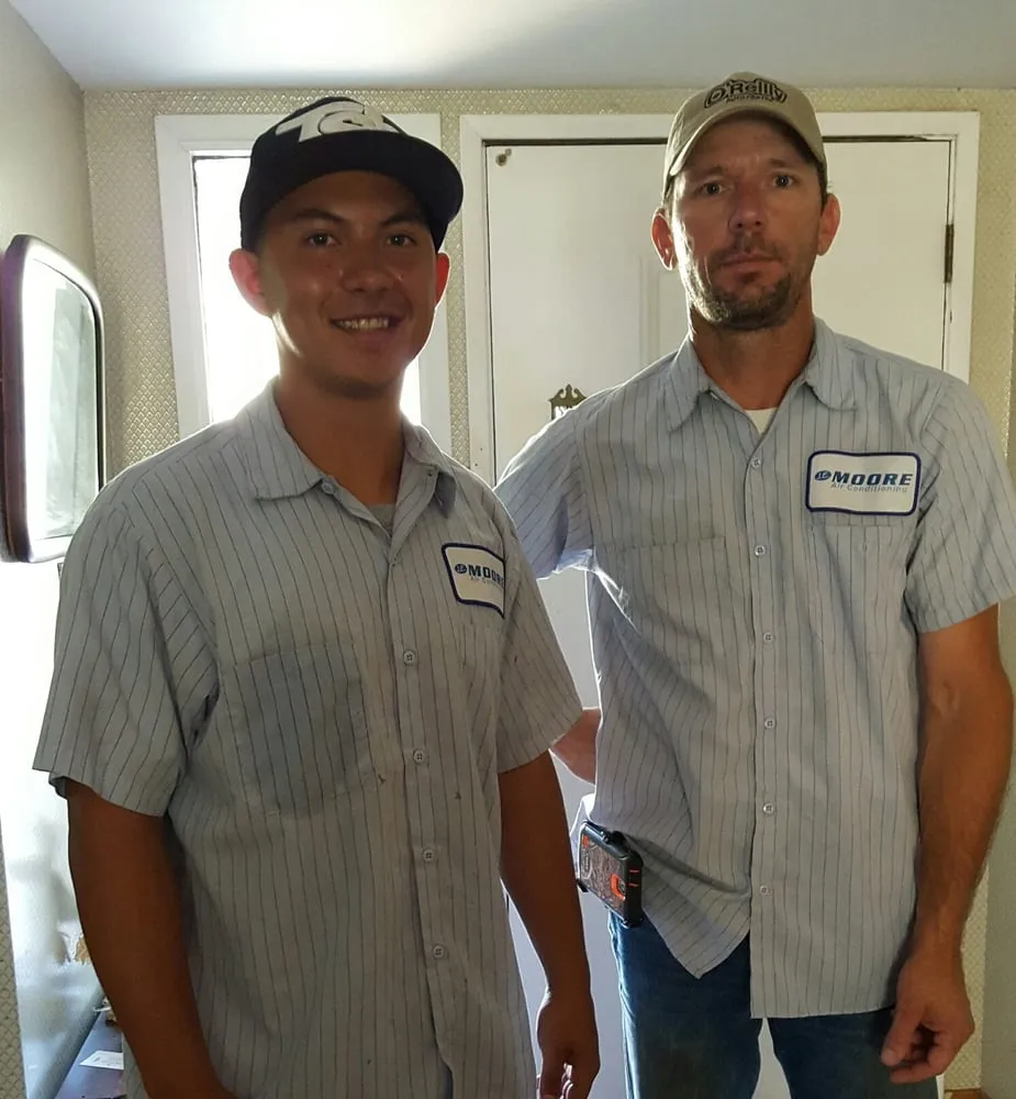 Slide of JE Moore Air Conditioning