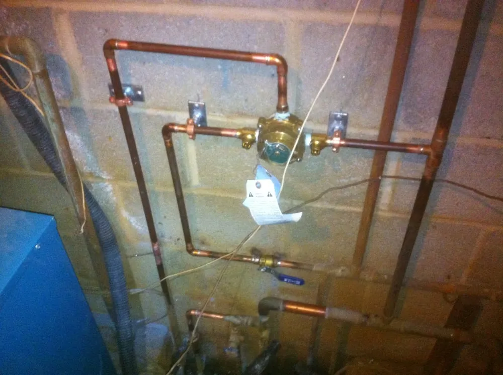 Slide of SJ Plumbing and Mechanical Building Services