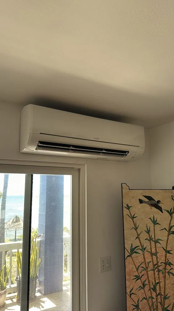 Slide of The AC Guys