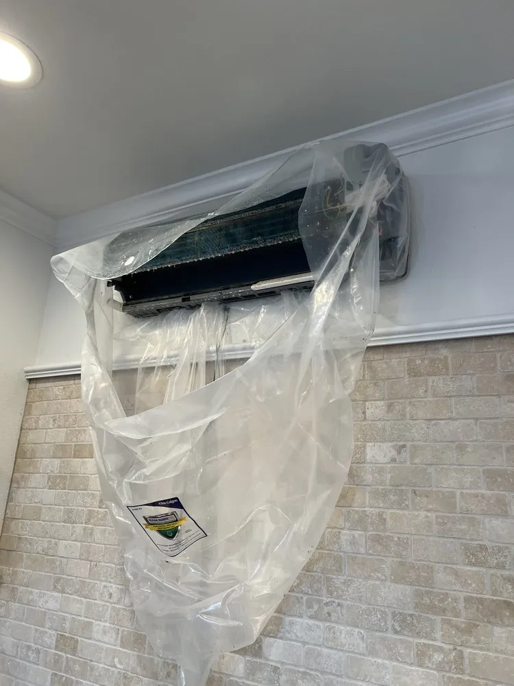 Slide of The AC Guys