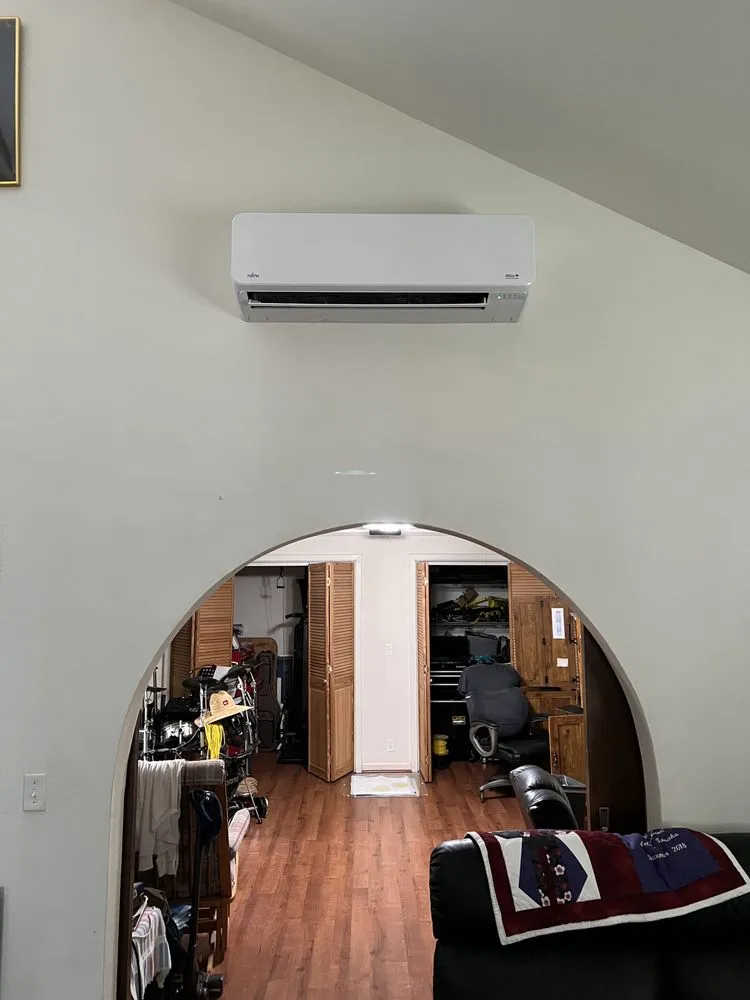 Slide of The AC Guys