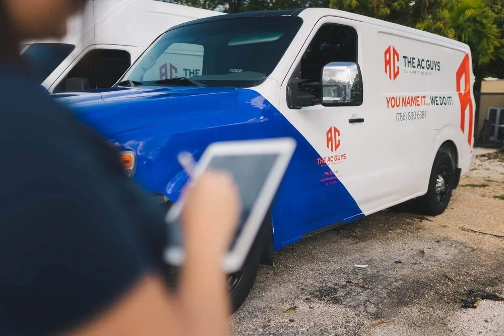 Slide of The AC Guys