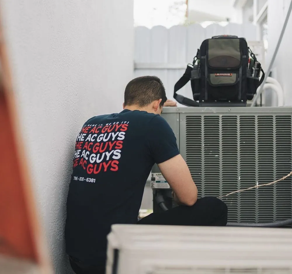 Slide of The AC Guys