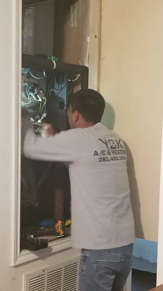 Slide of Y2K Air Conditioning & Heating Plus